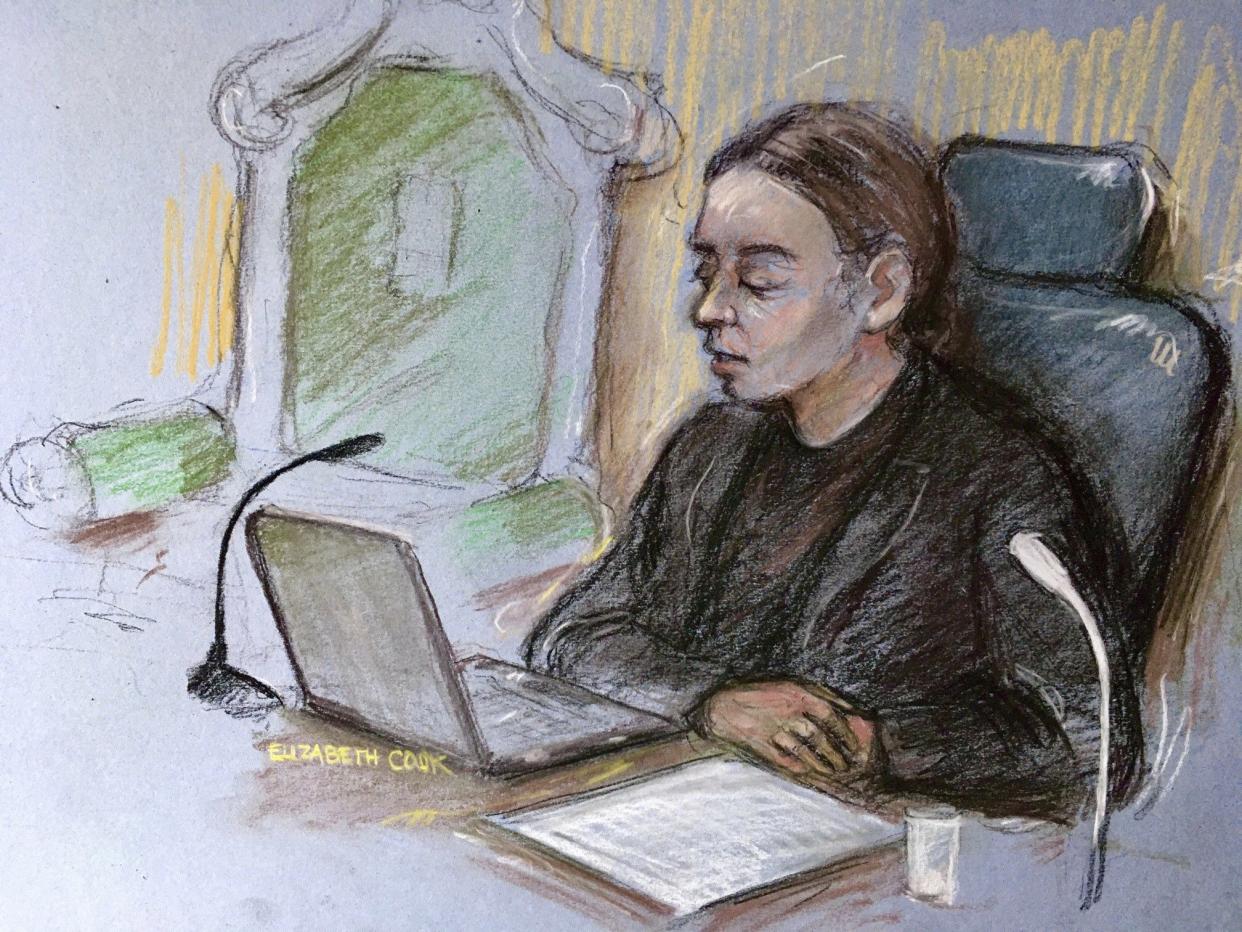 This is a court artist sketch by Elizabeth Cook, showing District Judge Vanessa Baraitser delivering her verdict in Julian Assange's extradition case at the Old Bailey court in London on Monday, Jan. 4, 2021.