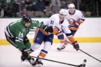 Nov 10, 2017; Dallas, TX, USA; Dallas Stars left wing Jamie Benn (14) and New York Islanders center John Tavares (91) fight for the puck during the third period at the American Airlines Center. The Stars shut out the Islanders 5-0. Mandatory Credit: Jerome Miron-USA TODAY Sports