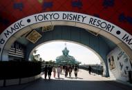 Visitors are seen outside Tokyo Disneyland in Urayasu