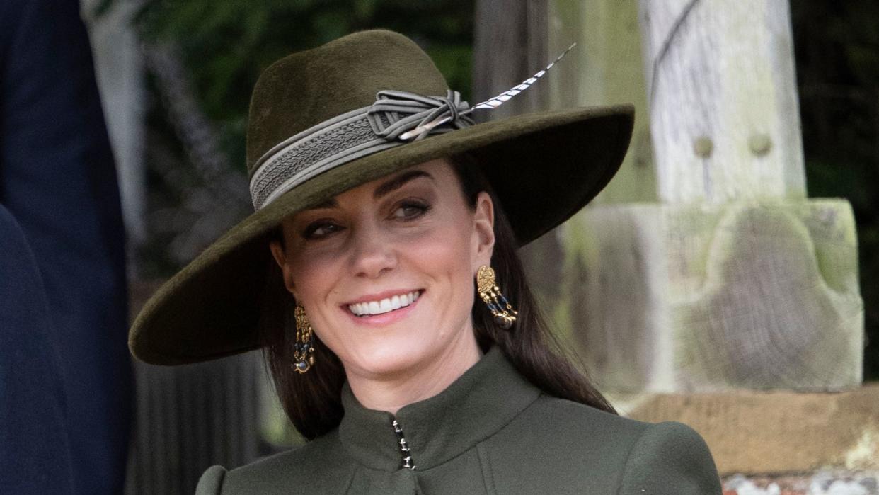 Kate wearing green coat and fedora hat in Sandringham