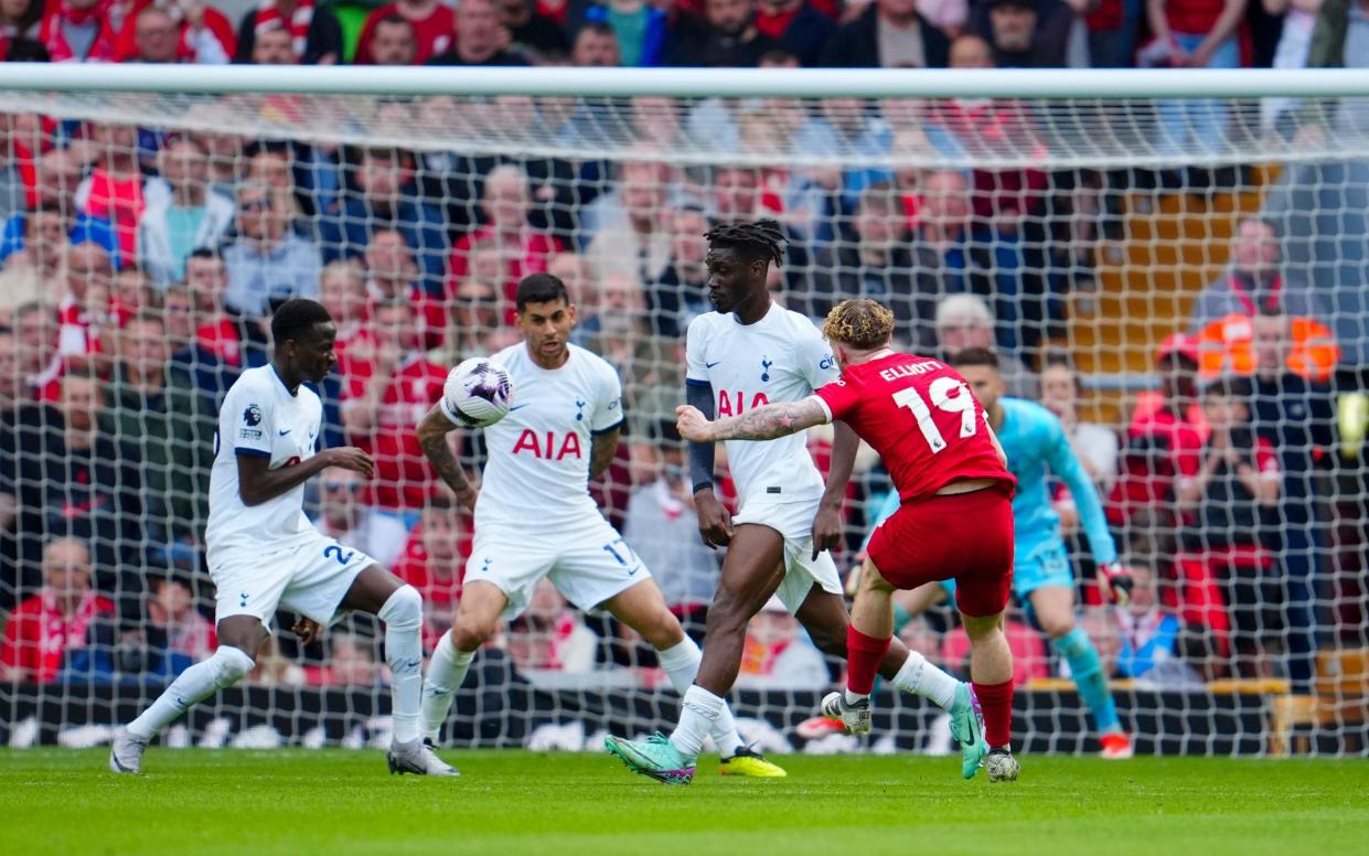 Liverpool's Harvey Elliott, front, scores his side's 4th goal during the English Premier League soccer match