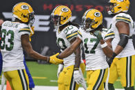 Green Bay Packers wide receiver Davante Adams (17) is congratulated by wide receiver Marquez Valdes-Scantling after scoring during the second half of an NFL football game against the Houston Texans Sunday, Oct. 25, 2020, in Houston. (AP Photo/Eric Christian Smith)