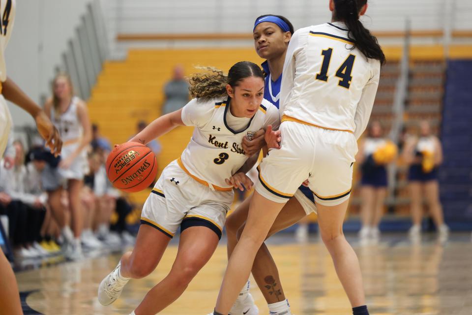 Kent State guard Katie Shumate (14) sets a pick for Kent State guard Corynne Hauser (3) to drive to the basket during the first half of an NCAA basketball game against the University of Buffalo, Wednesday, Jan. 4, 2022 in Kent, OH.