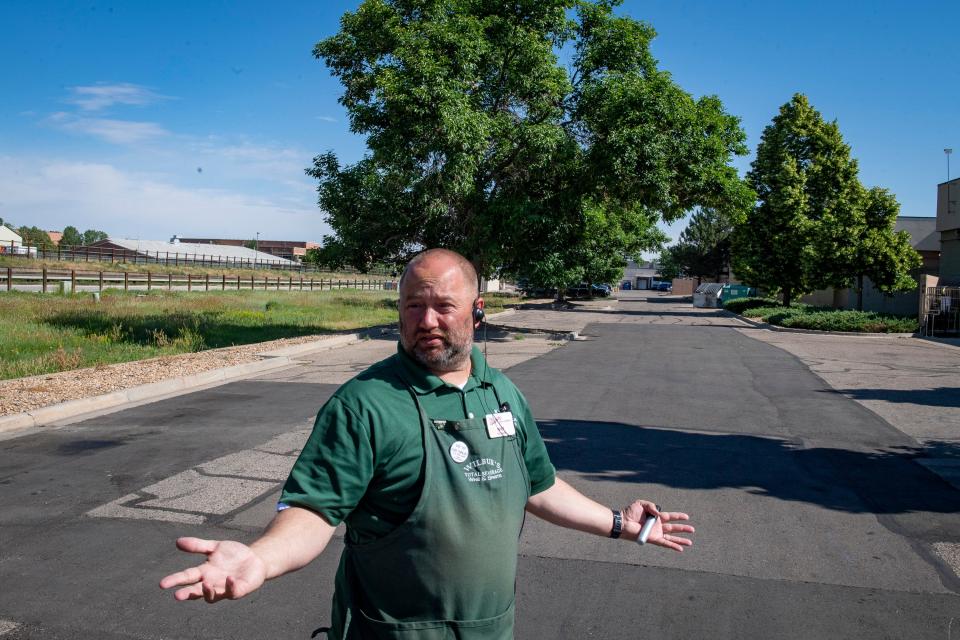 Mat Dinsmore, co-owner of Wilbur's Total Beverage, talks about the issues he's had with people experiencing homelessness near his store's plaza in Fort Collins on June 24.