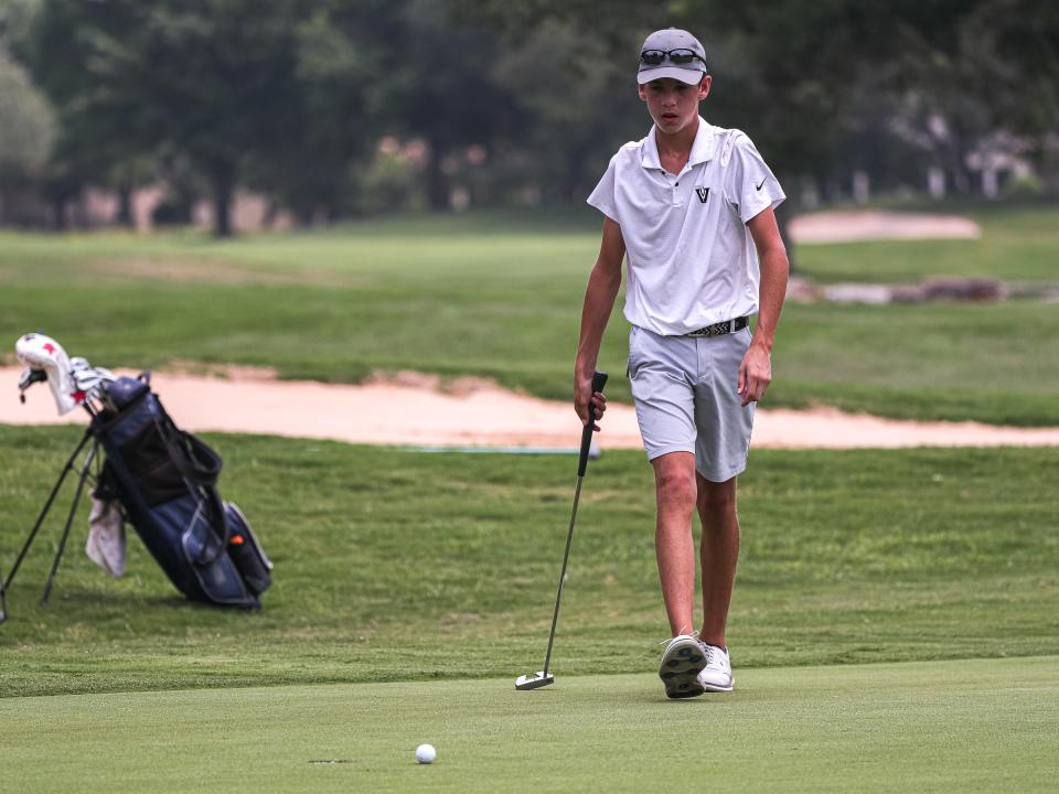Vandegrift's Jake Mayer walks onto the green to putt at the UIL Class 6A State Championship at Legacy Hills Golf Club in Georgetown on Monday. The Vipers trail first place Westlake by 22 shots after one round of play.