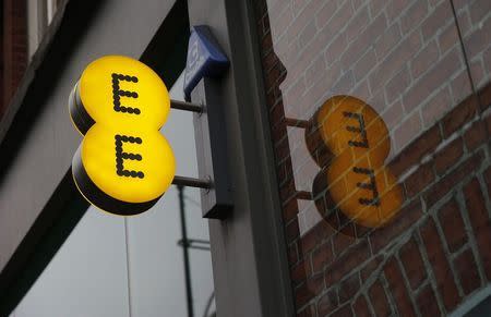 A sign is seen outside an EE shop on Oxford Street in London, November 26, 2014. REUTERS/Suzanne Plunkett