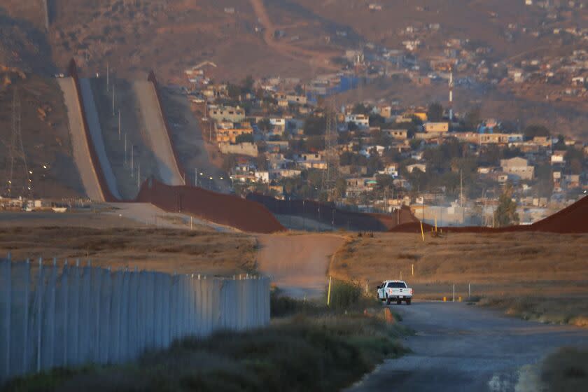 San Diego, California-Aug. 10, 2022-A U.S. Border Patrol agent patrols along the U.S. - Mexico border east of Otay Mesa, San Diego, California on Aug. 10, 2022. (Carolyn Cole / Los Angeles Times)