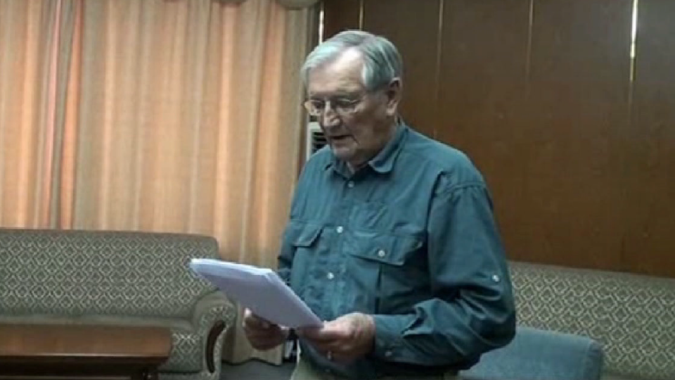 Merrill Newman reads a statement in an image from a video released by North Korea's state-run news agency, in 2013. - KCNA (North Korea state-run news)