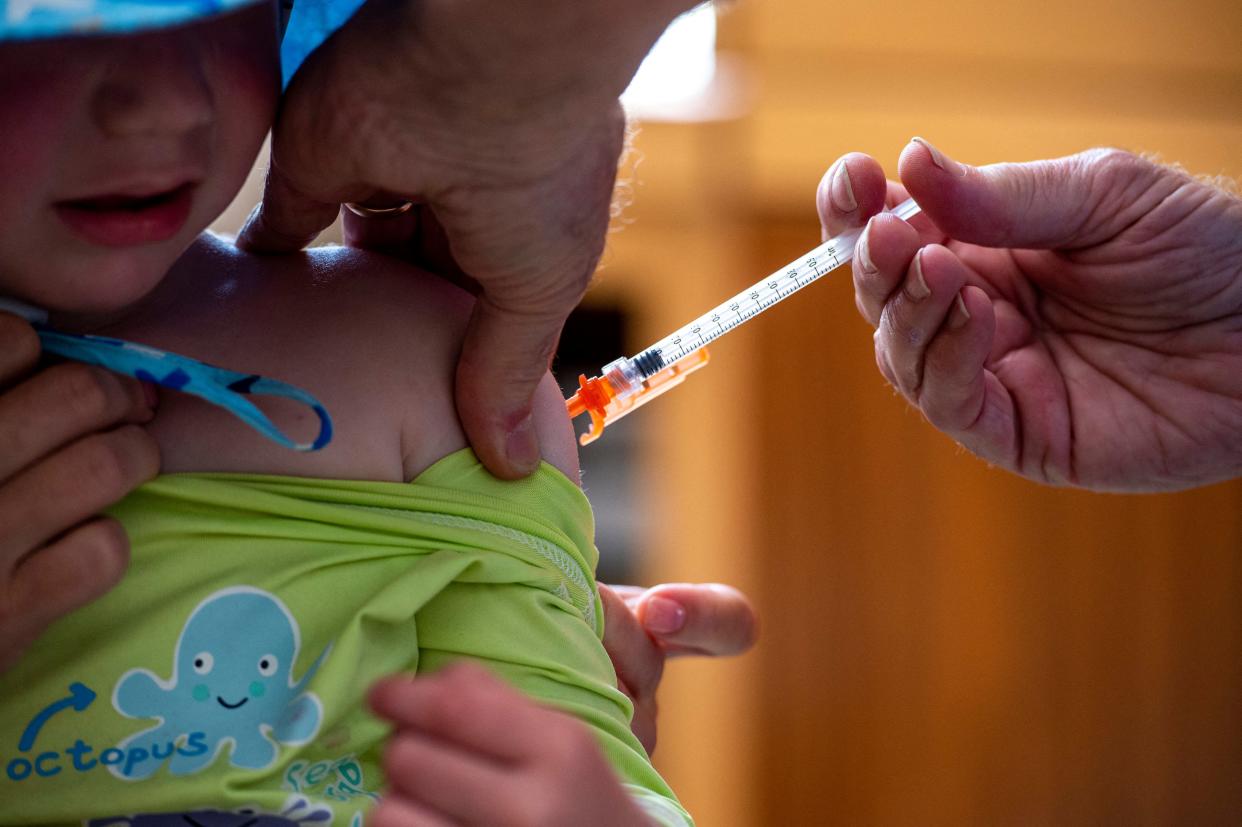 A child getting a shot.