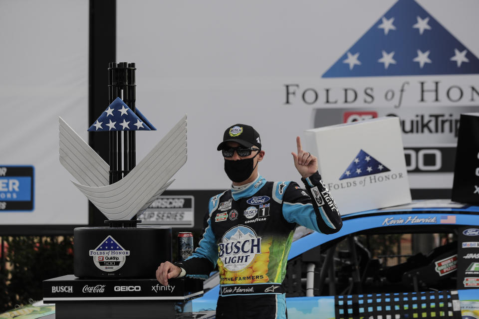 Kevin Harvick celebrates after winning a NASCAR Cup Series auto race at Atlanta Motor Speedway, Sunday, June 7, 2020, in Hampton, Ga. (AP Photo/Brynn Anderson)