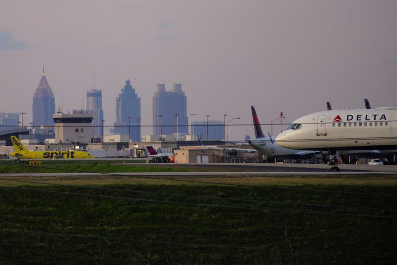 Delta Air Lines passenger planes crowd a runway in Atlanta