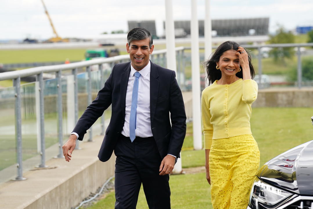 Rishi Sunak (pictured with his wife Akshata Murthy) is to announce the Tory manifesto shortly. (PA)