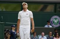 Sam Querrey of the U.S.A. reacts during his match against Roger Federer of Switzerland at the Wimbledon Tennis Championships in London, July 2, 2015. REUTERS/Stefan Wermuth