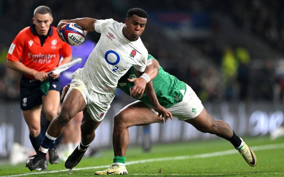 Immanuel Feyi-Waboso of England is tackled by Bundee Aki of Ireland