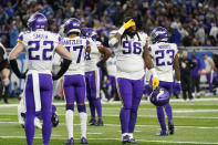 Members of the Minnesota Vikings stand on the field after the second half of an NFL football game against the Detroit Lions, Sunday, Dec. 5, 2021, in Detroit. (AP Photo/Paul Sancya)