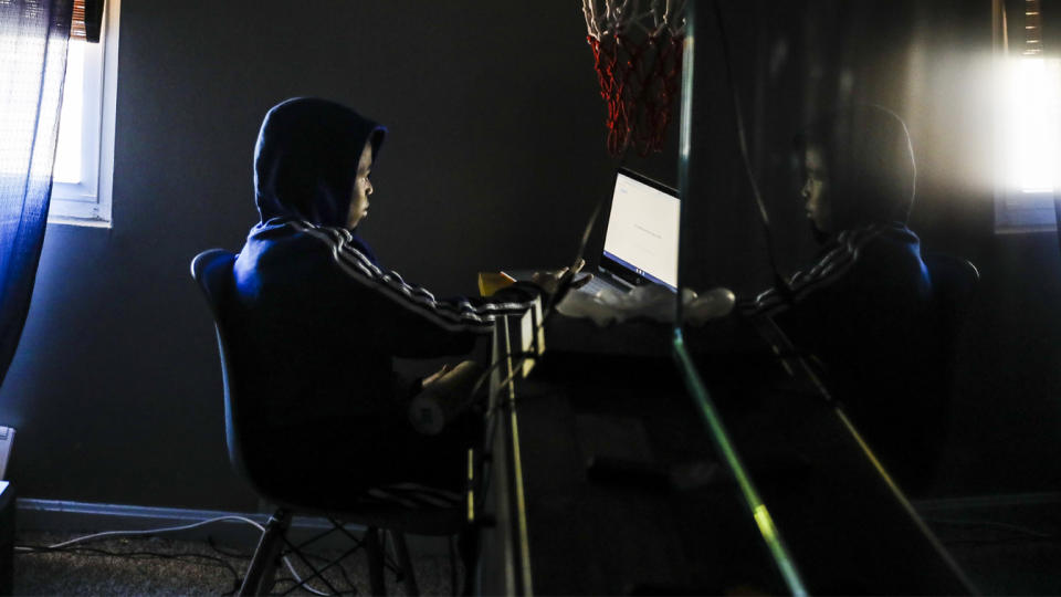 10-year-old Yassiah Lopez participates in his Zoom class while he does remote learning in Randolph, MA on Oct. 8, 2020. (Erin Clark/The Boston Globe via Getty Images)