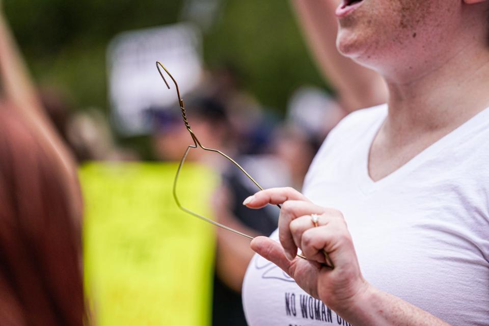 Abortion-rights supporters protest in front of the Indiana Statehouse on Wednesday, July 6, 2022, in Indianapolis. 