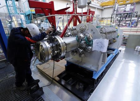 A technician works on Pemdyn loop which study the behaviour of a large flow rate electro-magnetic pump at the Cadarache CEA (Atomic Energy Authority) site near Saint-Paul-les-Durance, south eastern France, September 26, 2014. REUTERS/Jean-Paul Pelissier