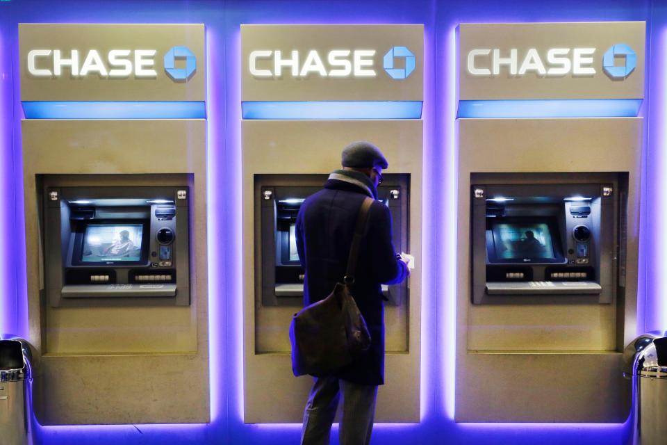 A customer uses an ATM at a branch of Chase Bank, Wednesday, Jan. 14, 2015 in New York.