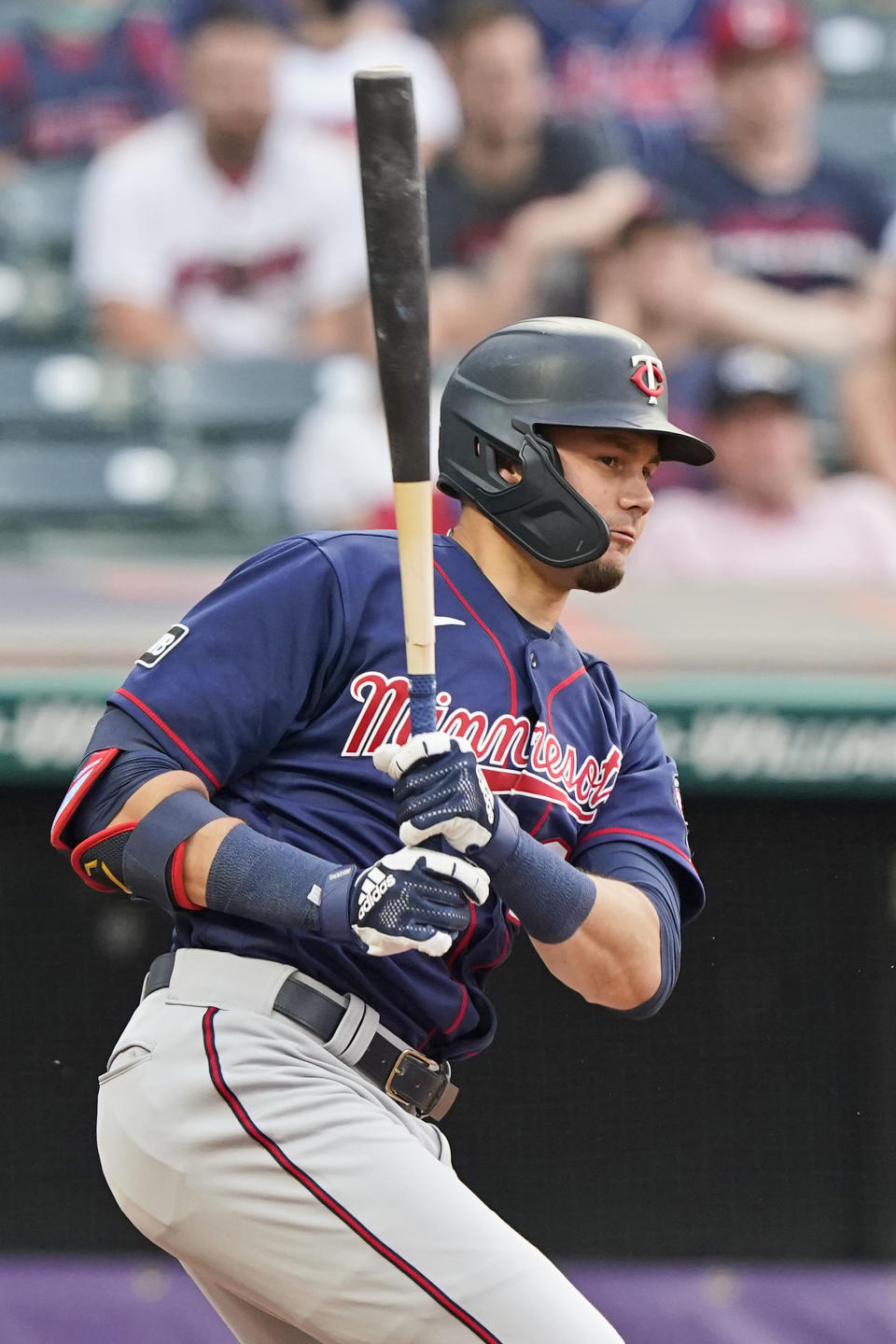 Minnesota Twins' Trevor Larnach grounds into a force-out in the fourth inning of a baseball game against the Cleveland Indians, Friday, May 21, 2021, in Cleveland. Alex Kirilloff and Max Kepler scored on the play. Larnach advanced to second base on a throwing error by Amed Rosario. (AP Photo/Tony Dejak)