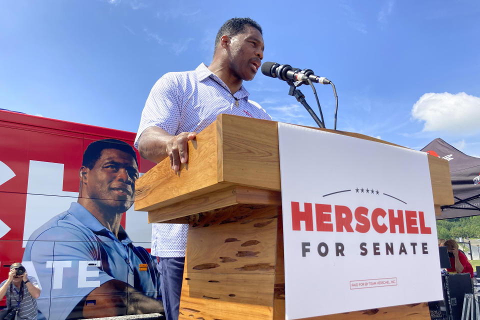 Republican Senate nominee Herschel Walker campaigns Wednesday, Sept. 7, 2021, in Emerson, Georgia, north of Atlanta. Walker told supporters they must "take back" the seat now held by Sen. Raphael Warnock, a Democrat. Walker and Warnock are locked in a tight race, and the two campaigns are jousting publicly over when the two men might debate. (AP Photos/Bill Barrow)