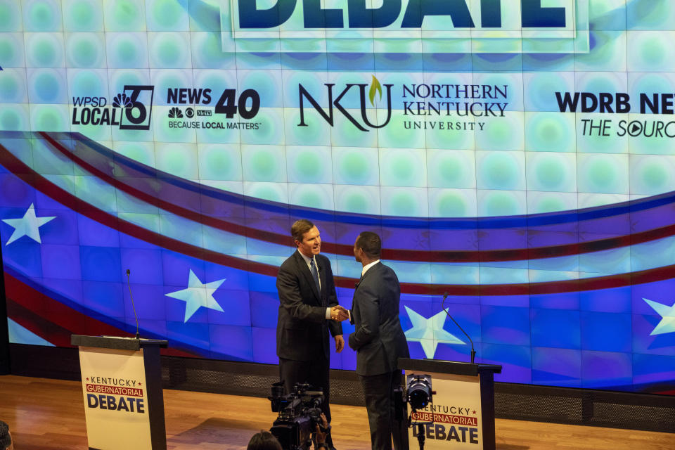 Democratic Gov. Andy Beshear, left, and Republican Attorney General Daniel Cameron shake hands at a gubernatorial debate at Northern Kentucky University, in Highland Heights, Ky., Monday, Oct. 16, 2023. (Joe Simon/LINK nky via AP, Pool)