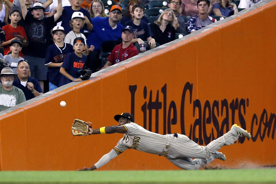 San Diego Padres left fielder Jurickson Profar makes a diving catch on a fly ball hit by Detroit Tigers' Jonathan Schoop during the 9th inning of a baseball game Tuesday, July 26, 2022, in Detroit. (AP Photo/Duane Burleson)