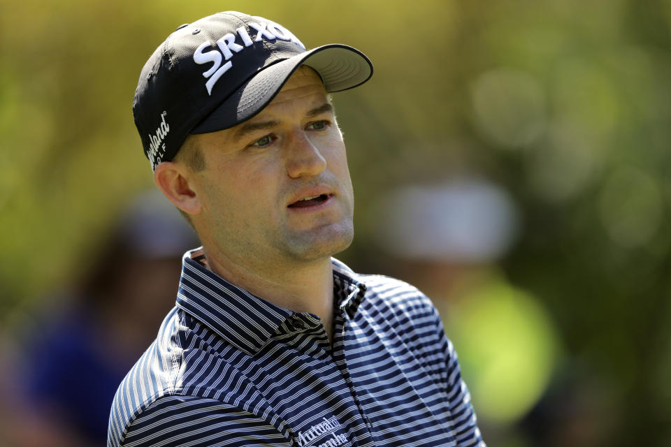 FILE - In this March 15, 2019, file photo, Russell Knox, of Scotland, is shown during the second round of The Players Championship golf tournament in Ponte Vedra Beach, Fla. Players, caddies and key staff around them will be tested once a week for the new coronavirus, and everyone at the golf course will have their temperatures taken every day when the PGA Tour returns next month and tries to show it can resume its season with minimal risks. And the tournament won’t shut down if someone tests positive. Such a player would have to withdraw immediately and self-isolate for at least 10 days provided there are no subsequent symptoms and he gets two negative test results 24 hours part. “That was the No. 1 concern,” said Knox, who serves on the Player Advisory Council. (AP Photo/Gerald Herbert, File)