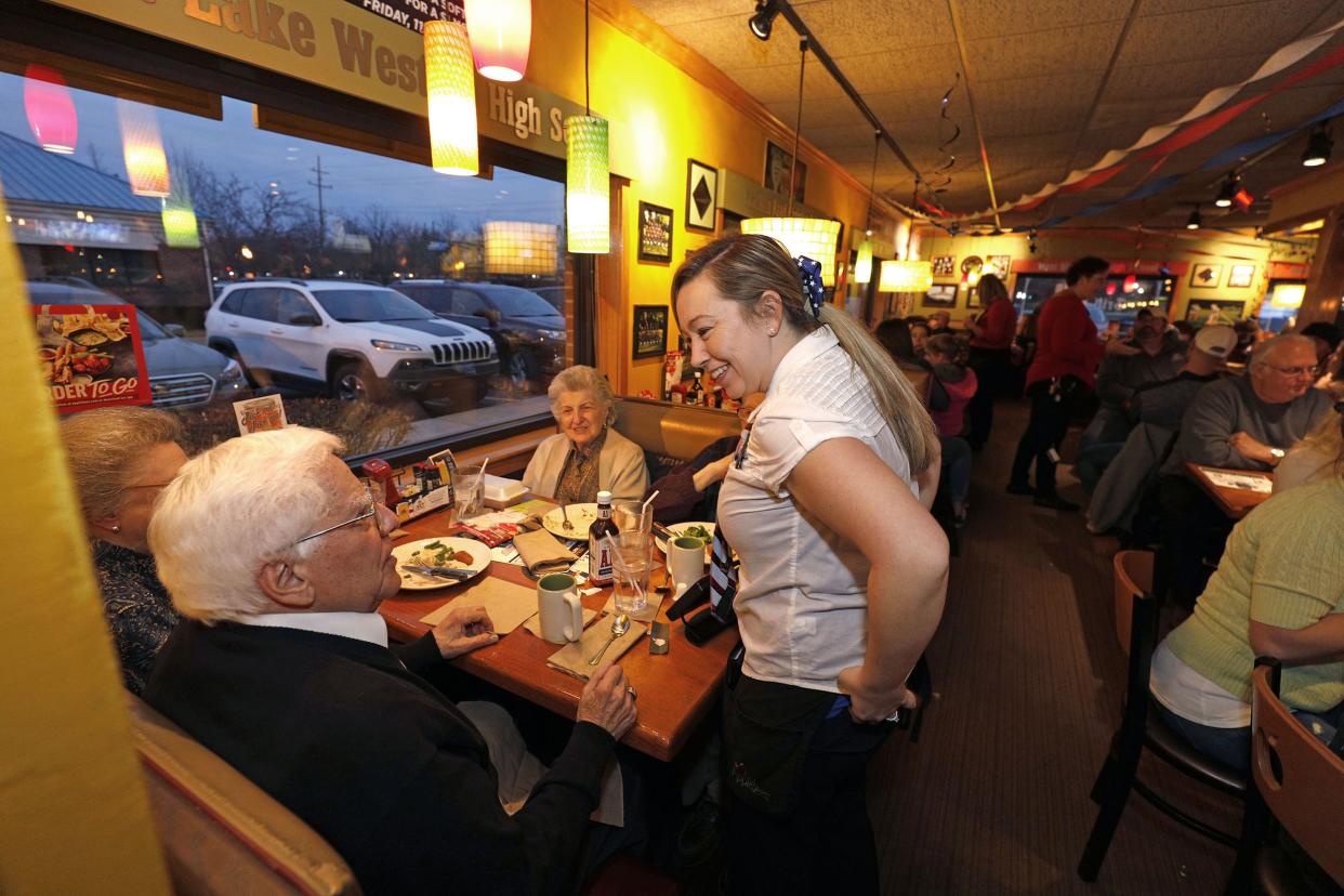 waitress serving customers at Applebees Neighborhood Grill & Bar on Sunday, November 11, 2018 in Commerce Township, Michigan