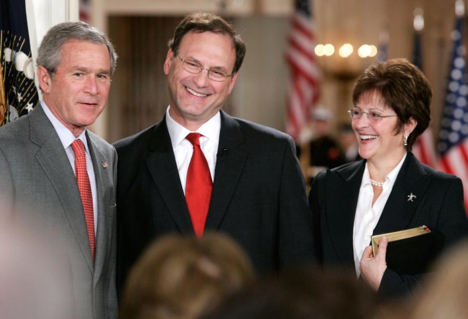 Supreme Court Justice Samuel Alito and Martha-Ann Alito share a smile during a ceremonial swearing-in at the East Room of the White House February 1, 2006 (Getty Images)