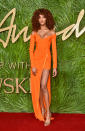 <p>Supermodel Jourdan Dunn sported a curly hair look as she graced the red carpet in an orange thigh-split dress. (Photo: Getty Images) </p>