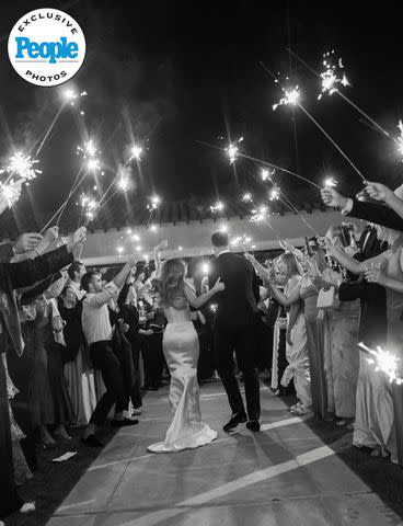 <p>Valorie Darling Photography</p> Katie Austin and Lane Armstrong are celebrated with sparklers