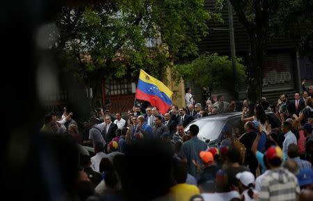 FILE PHOTO: People arrive at a session of Venezuela's opposition-controlled National Assembly that appoints alternative judges to the Supreme Court in Caracas, Venezuela, July 21, 2017. REUTERS/Ueslei Marcelino