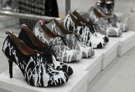 FILE - This Feb. 11, 2013 file photo shows shoes to be worn by models displayed backstage before the showing of the Thom Browne Fall 2013 collection during Fashion Week in New York. As New York Fashion Week's fall previews wrapped up Thursday, designers didn't ignore the feet. (AP Photo/Louis Lanzano, file)