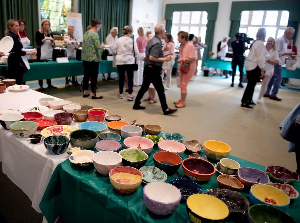 Ceramic bowls are given to guests during the Palm Beach County Food Bank's 11th Annual Empty Bowls Palm Beach, held Friday at the Episcopal Church of Bethesda-by-the-Sea.