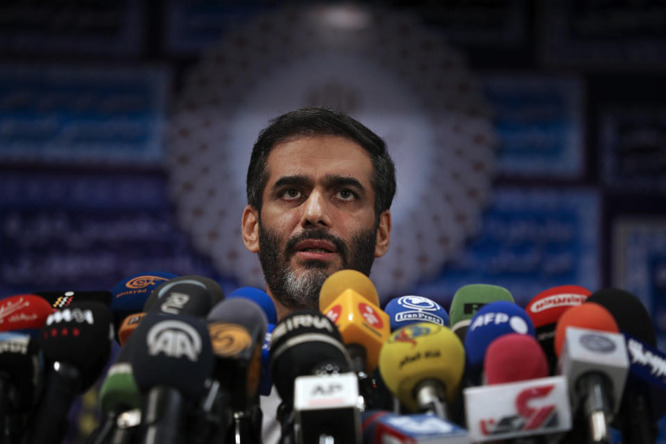Revolutionary Guard Gen. Saeed Mohammad, who once headed the the paramilitary force's Khatam al-Anbiya Construction Headquarters, speaks with media after registering his name as a candidate for the June 18 presidential elections at the elections headquarters of the Interior Ministry in Tehran, Iran, Tuesday, May 11, 2021. Iran opened registration Tuesday for potential candidates in the country's June presidential election, kicking off the race as uncertainty looms over Tehran's tattered nuclear deal with world powers and tensions remain high with the West. (AP Photo/Vahid Salemi)