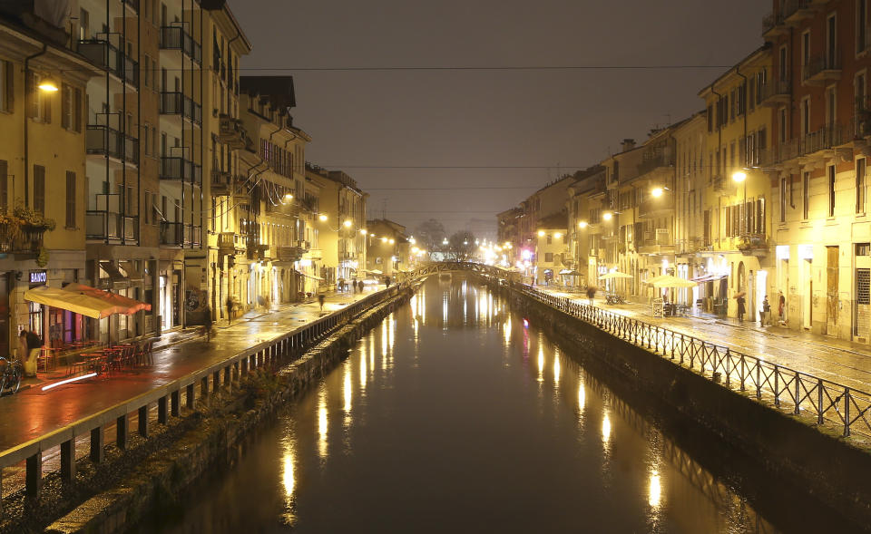 This Jan. 16, 2014 photo shows a night view of Naviglio water canal in Milan, Italy. The canals are the center of Milan's nightlife. (AP Photo/Antonio Calanni)