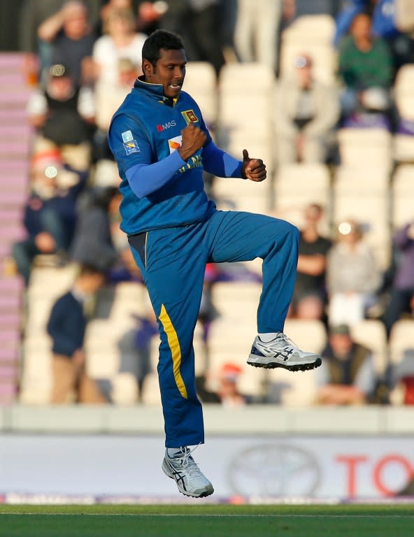 Sri Lanka's captain Angelo Mathews celebrates after bowling England's Jason Roy during their T20 match, at The Ageas Bowl in Southampton, on July 5, 2016