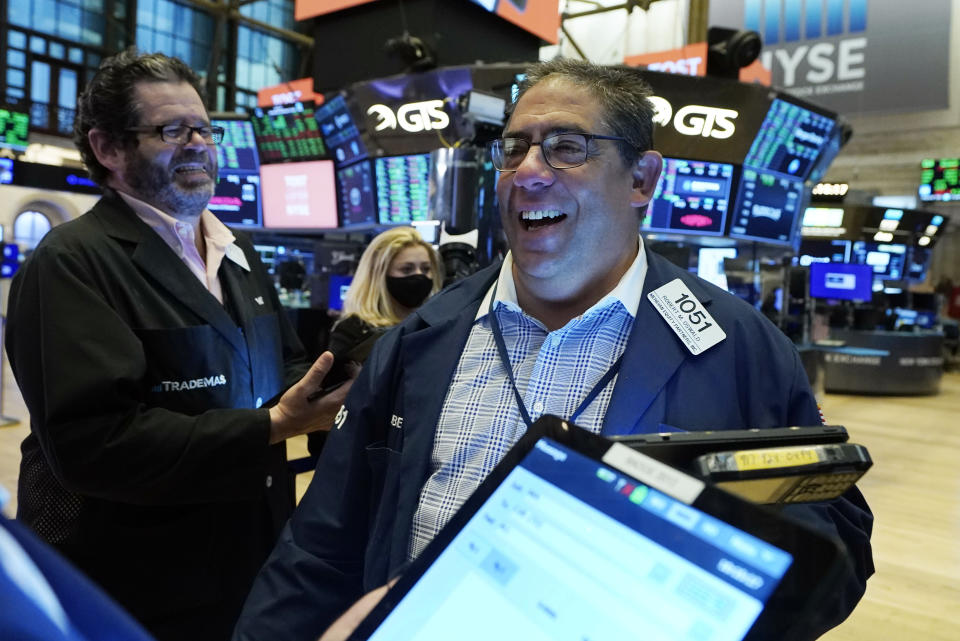 Trader Robert Oswald, right, works on the floor of the New York Stock Exchange, Wednesday, Sept. 22, 2021. Stocks rose broadly on Wall Street Wednesday ahead of an update from the Federal Reserve on how and when it might begin easing its extraordinary support measures for the economy. (AP Photo/Richard Drew)