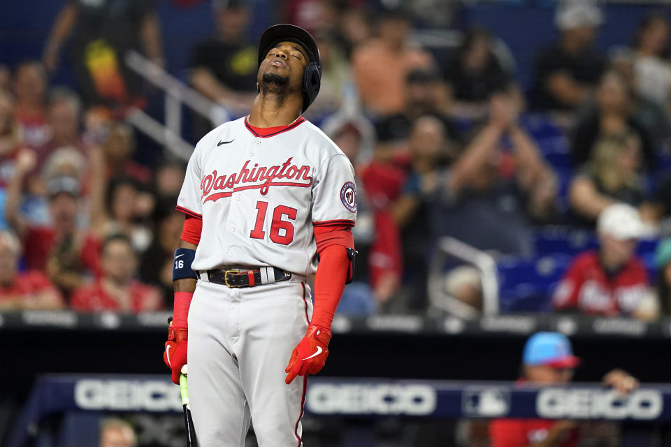 Washington Nationals' Victor Robles (16) reacts after being called out on strikes during the fifth inning of a baseball game against the Miami Marlins, Saturday, Sept. 24, 2022, in Miami. (AP Photo/Lynne Sladky)