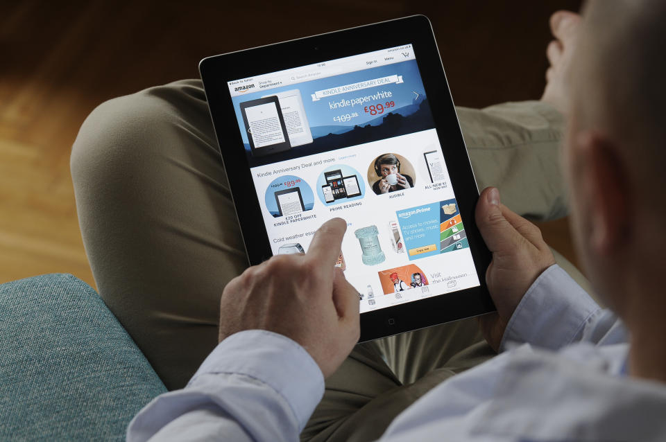 A man is seen looking at the Amazon.com homepage on an iPad on October 24, 2017. (Photo by Jaap Arriens/NurPhoto via Getty Images)