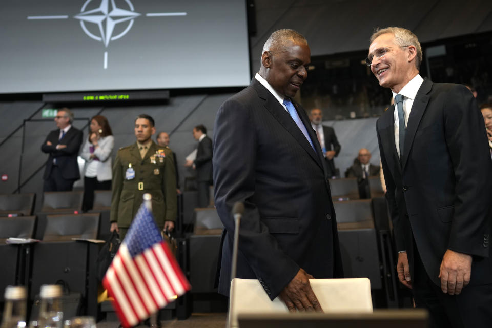 United States Secretary of Defense Lloyd Austin, center, speaks with NATO Secretary General Jens Stoltenberg during a meeting of the North Atlantic Council in NATO defense ministers format at NATO headquarters in Brussels, Friday, June 14, 2024. (AP Photo/Virginia Mayo)