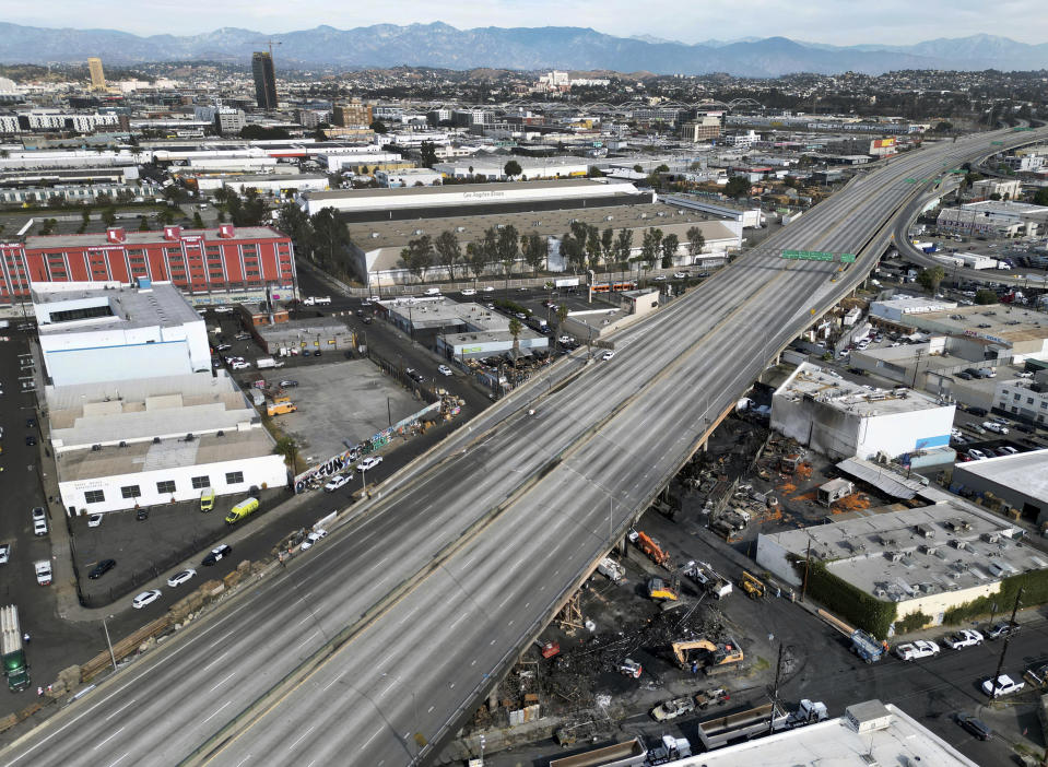 The area of a fire on Lawrence Street shown below, in a portion of Interstate 10 in Los Angeles, between Alameda Street and Santa Fe Avenue on Monday, Nov. 13, 2023. Los Angeles will be without a section of a vital freeway that carries more than 300,000 vehicles daily for an uncertain amount of time following a massive weekend fire at a storage yard, officials warned Monday. (Dean Musgrove/The Orange County Register via AP)