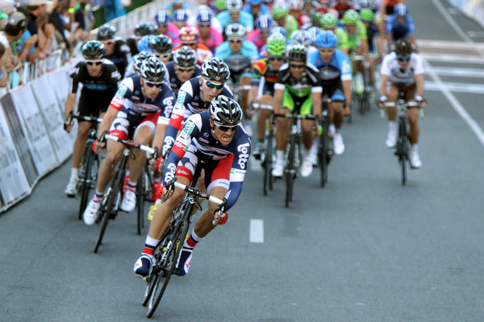 ADELAIDE, AUSTRALIA - JANUARY 15: Adam Hansen of Australia and Team Lotto - Belisol leads the peleton with one lap to go during the 2012 Tour Down Under Classic on January 15, 2012 in Adelaide, Australia. (Photo by Morne de Klerk/Getty Images) *** BESTPIX ***