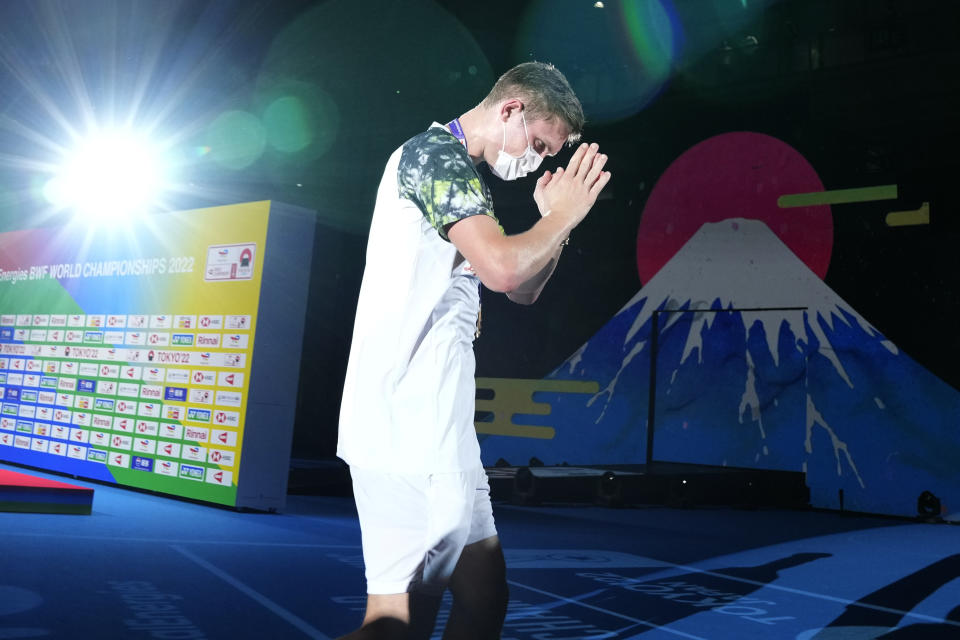 Denmark's Viktor Axelsen reacts as he celebrates his victory over Thailand's Kunlavut Vitidsarn in their men's singles badminton final match at the BWF World Championships in Tokyo, Japan, Sunday, Aug. 28, 2022. (AP Photo/Shuji Kajiyama)