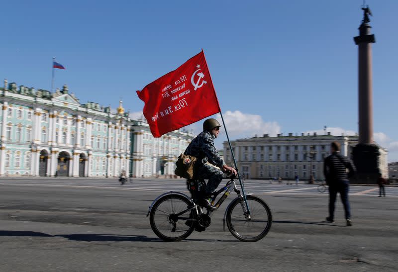 A man rides a bicycle during the celebrations of Victory Day in Saint Petersburg