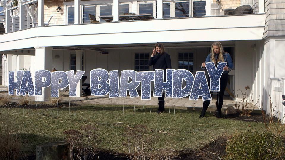 Tara Collinson and Michelle Honauer show off one of the kinds of signs they rent out through their Manasquan business, Yippee! Yard Cards.