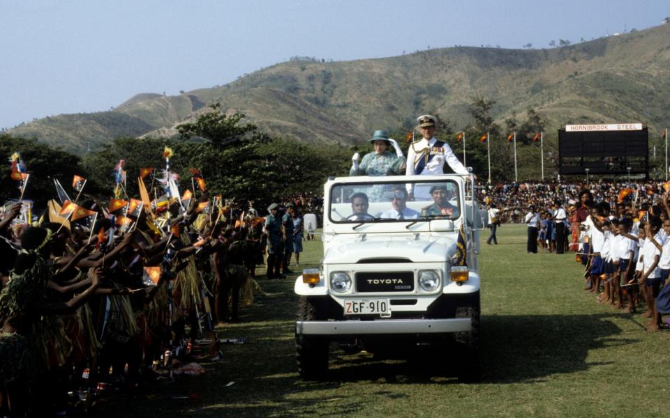 Queen Elizabeth ll and the Duke of Edinburgh during an official tour of Papua New Guinea  - Credit: Anwar Hussein/Getty Images