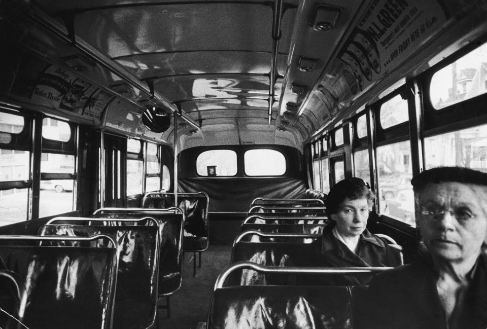  Two white women sit in an otherwise empty bus during the African-American boycott of bus companies throughout Montgomery, Alabama, in March 1956. The political protest campaign eventually led to a US Supreme Court's decision that declared the Alabama and Montgomery laws requiring segregated buses unconstitutional. 