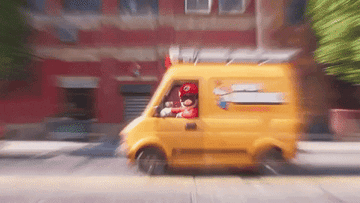 Mario and Luigi nodding from the interior of their plumbing company van in "The Super Mario Bros. Movie"